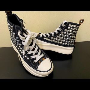 Steve Madden high top sneaker with sliver studs .